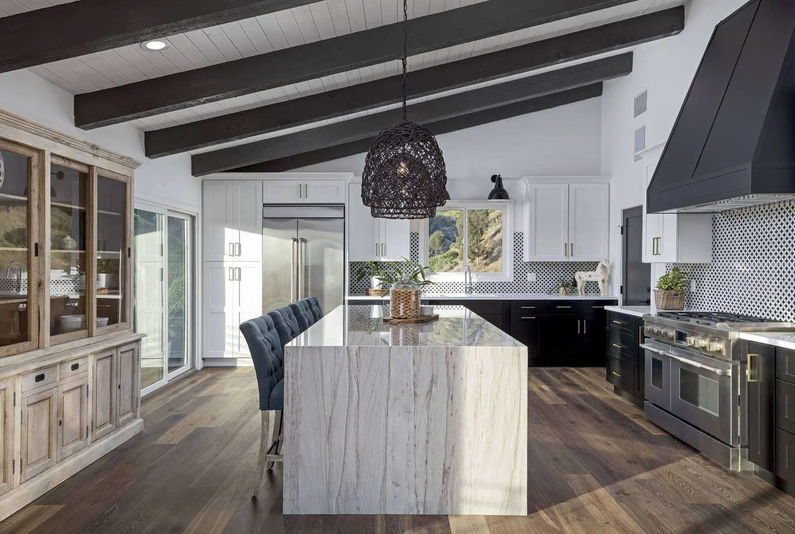 Remodeled kitchen with custom cabinets and island by Star Home Remodeling