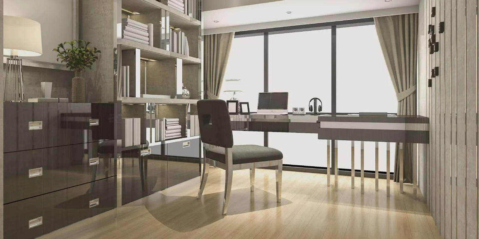 Home office with a long desk, storage wall and sliding doors to the garden